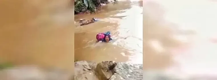 menyeberangi-derasnya-sungai-demi-pasien:-kisah-pengabdian-bidan-dona-di-pasaman