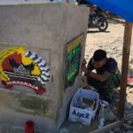 Satgas TMMD Bersama Warga Selesaikan Tugu di Sungai Geringging
